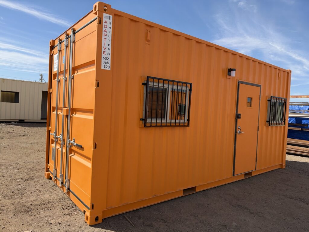 20 foot container office exterior, angled view with door and barred windows